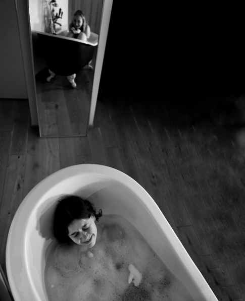 woman on bathtub